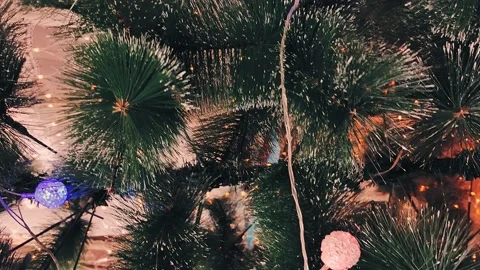 Vertically Decorated Christmas tree with lights and gold and red balls Stock Footage 143569563