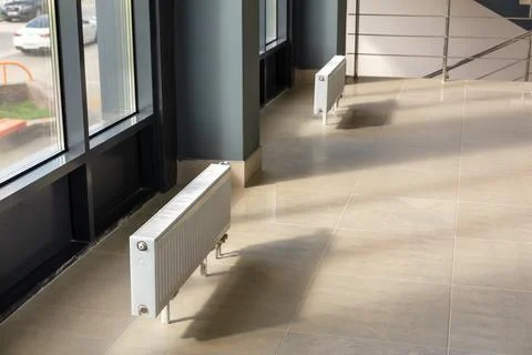 Vertically installed central heating radiator Stock Photos