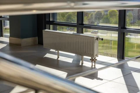 Vertically installed central heating radiator Stock Photos