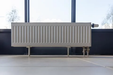 Vertically installed central heating radiator Stock Photos