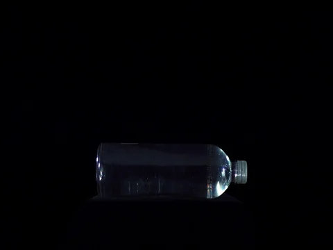 Vertically kept water bottle breaking in slow motion Stock Footage 81185341