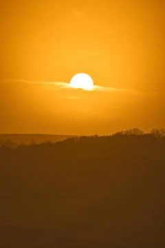 A vertically oriented orange sunset sky Stock Photos