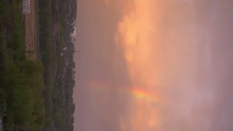 Vertically. rainbow over the river during sunset. the view from the mountains Stock Footage 129697371