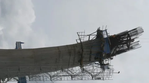 Vertically shoot, workers on unfinished bridge construction site Stock-Footage 142121376