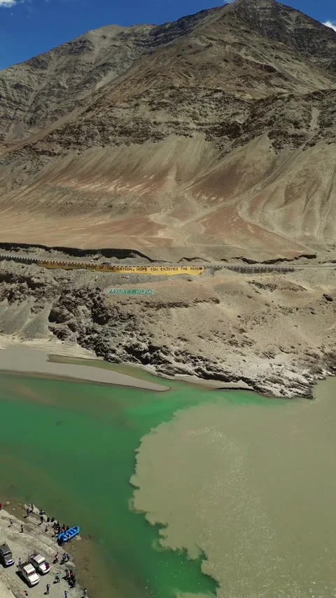 Verticlal Drone capture of Indus and Zanskar rivers joining under clear skies of Stock Footage 310807236