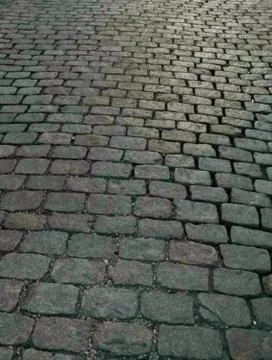 A verticle image of a cobblestone street Stock Photos
