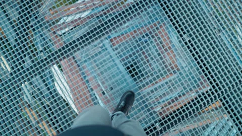 Vertiginous image capturing foot on precipice, Dramatic shot showcasing foot Stock Footage 319468685