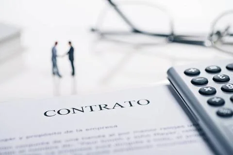 Vertragsabschluss Conclusion of a contract with the spanish word Contrato ... Stock Photos