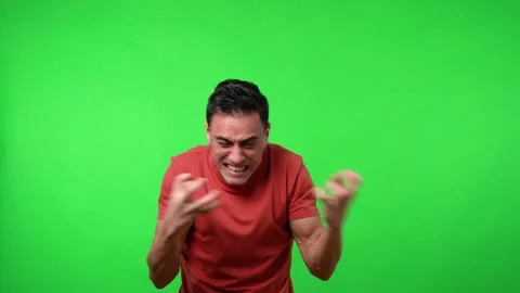 Very angry man gesturing uncontrollably. Chroma green background. 動画素材 148458446