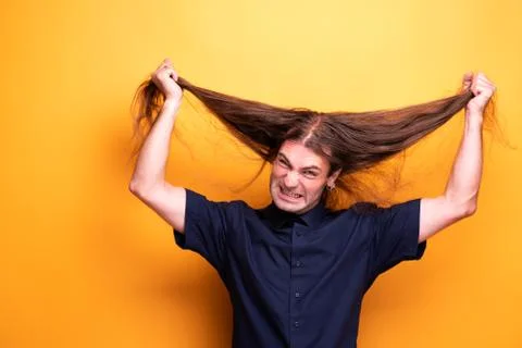 Very angry man pulling his hair Stock Photos