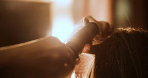 Very attractive blonde master does her hair, put make-up on her face, makes Stock Footage 99509336