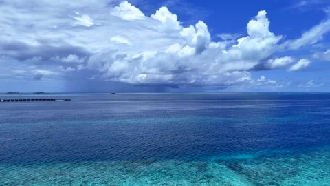 Very beautiful clouds over the water and coral island Stock Footage 293077828