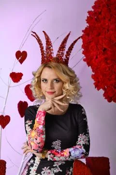 Very beautiful cute blonde girl, princess with big, red crown Stock Photos