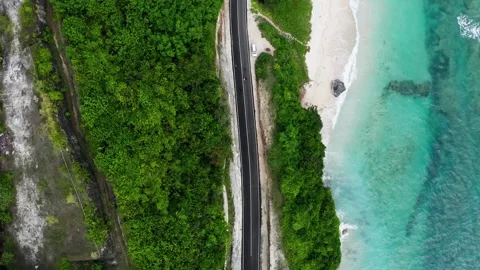 Very beautiful drone view over the beach with road, coastline in Bali, 2K Stock Footage 246163676
