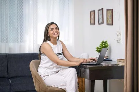 Very Beautiful Lady Smiling While Working On Laptop 스톡 사진