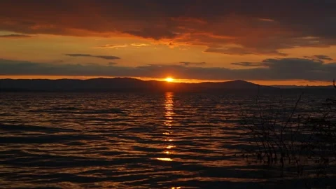 A very beautiful sunset landscape with views of the lake and mountains. Stock-Footage 343733893