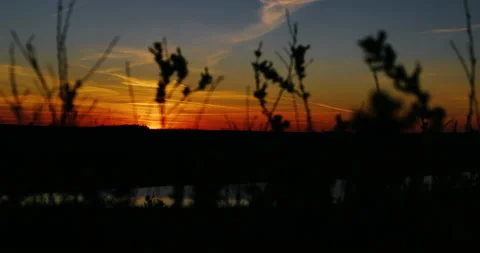 A very beautiful sunset, the sun is setting over the horizon.  Video stock 153880132