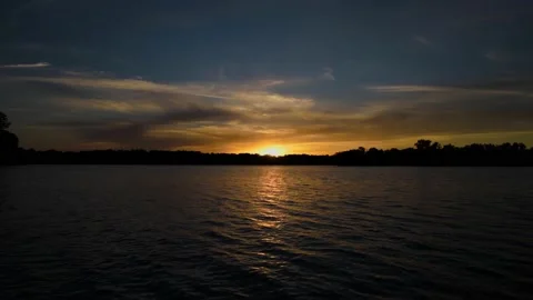 A very beautiful sunset time-lapse shot on the river bank. Stock Footage 138734999