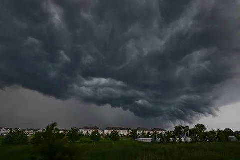 A very big dark cloud is coming down over the city Foto stock