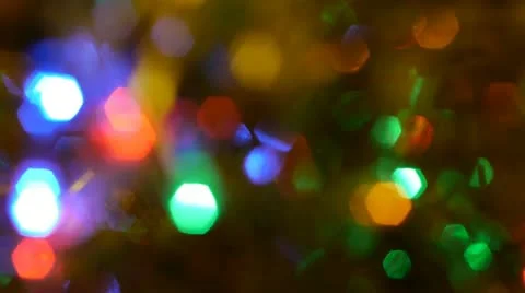 Very blurred tracking shot of Christmas lights and tinsel. Stock Footage