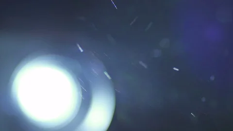 The very bright projector light with dust particle stream. Macro close up view Stock Footage 69752821