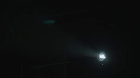 The very bright projector light with a dust particle stream. Real time capture Stock Footage 129340943