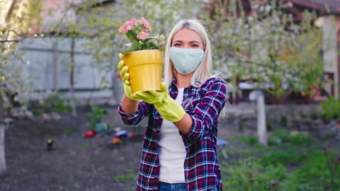 Very charismatic lady with a protective mask in front of the camera in pandemic Stock Footage 131664522