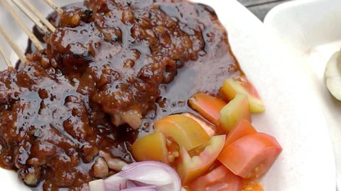 From very close and from above chicken satay with peanut sauce Stock Footage 272298065