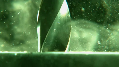 Very close drill drills a sheet metal. Particles are scattered. Stock Footage 132293955
