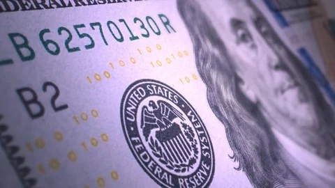A very close-up of a hundred dollars. Benjamin Franklin winks at a hundred-dolla Stock Footage 75070919