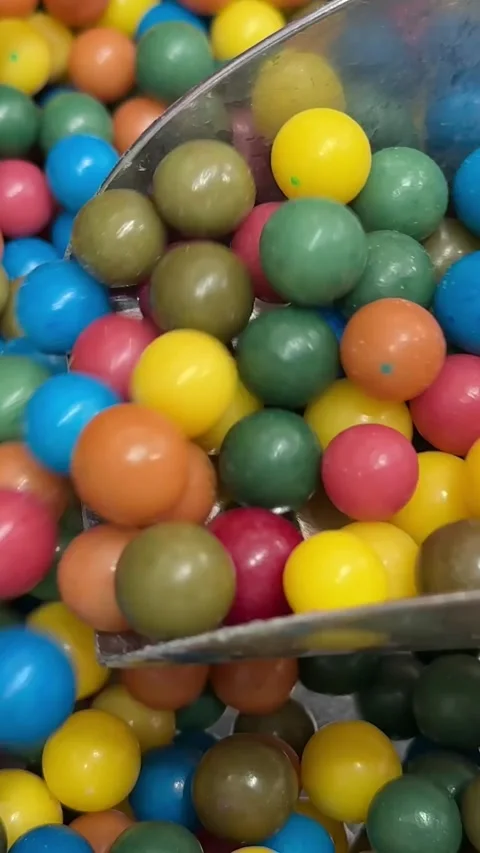 Very Close-up.Multi-colored candy balls on a delicious background and a tree Video stock 306281472