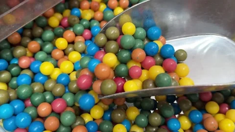 Very Close-up.Multi-colored candy balls on a delicious background and a tree Video stock 306283001