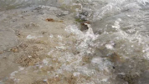 Very close video recording of waves gently lapping the cliff 4327 Stock Footage 107400113