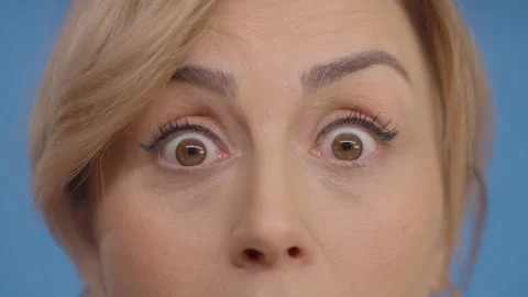 Very close-up of a young woman's surprised eyes. 動画素材 148665343