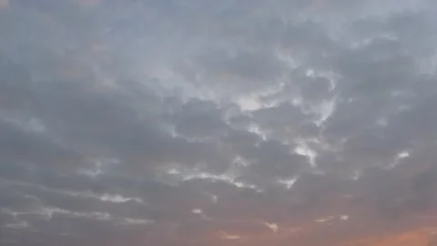 Very cloudy sky at sunrise - background - time lapse Stock Footage 143346177