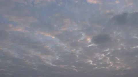 Very cloudy sky at sunrise - background - time lapse Stock Footage 143347665