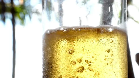 Very cold beer stream and detail of the bubbles in super slow motion Stock Footage 102671157