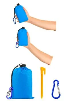 Very compact hand held blue nylon pocket blanket in a drawstring Stock Photos
