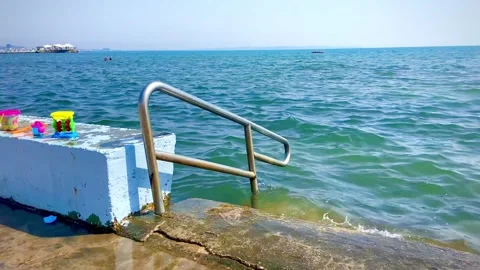 Very convenient comfortable entry into the sea from the beach Stock Footage 248680219