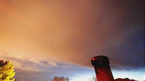 Very cool long-exposure timelapse night sky with chimney sparks Stock Footage 37100011
