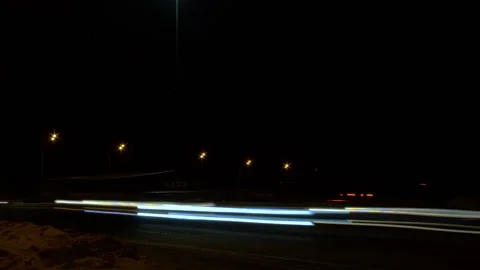 Very dark, night accelerated video of the headlights of cars Stock Footage 167811934
