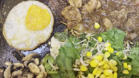 A very delicious mixed beef and chicken teppanyaki dish at a Japanese restaurant Stock Footage 278382380