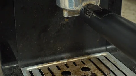 Very dirty coffee machine. Perhaps a repair is required. The coffee is drippi Stock Footage 84738098