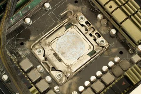 Very dirty computer processor. Dusty CPU microchip on a computer motherboard 写真素材