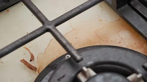 Very dirty cooking panel in burnt fat and pieces of food, close-up Stock Footage 151920077