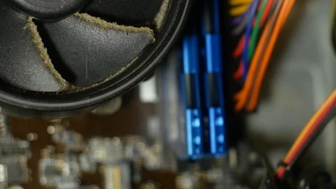 A very dirty CPU cooler starts spinning and then stops Stock-Footage 127524892