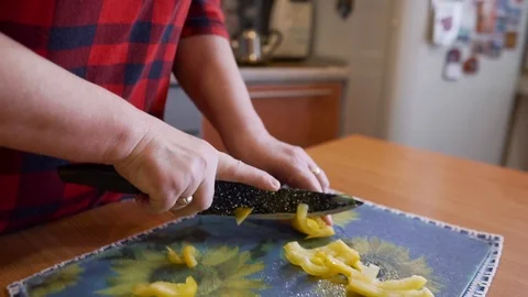 Very dynamic shooting of the pepper slicing process by the cook Stock Footage 123724713