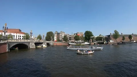 Very dynamic Time Lapse Of Boats On Amsterdam Canals in summer day. Video stock 131747316