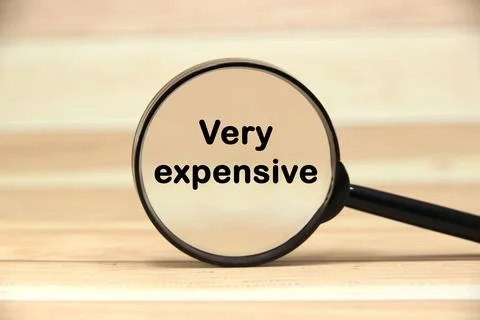 Very expensive Text or message short word english letter on black magnifyin.. Stock Photos