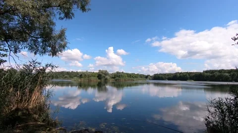 Very fast flying clouds over the lake. Stock Footage 136672172